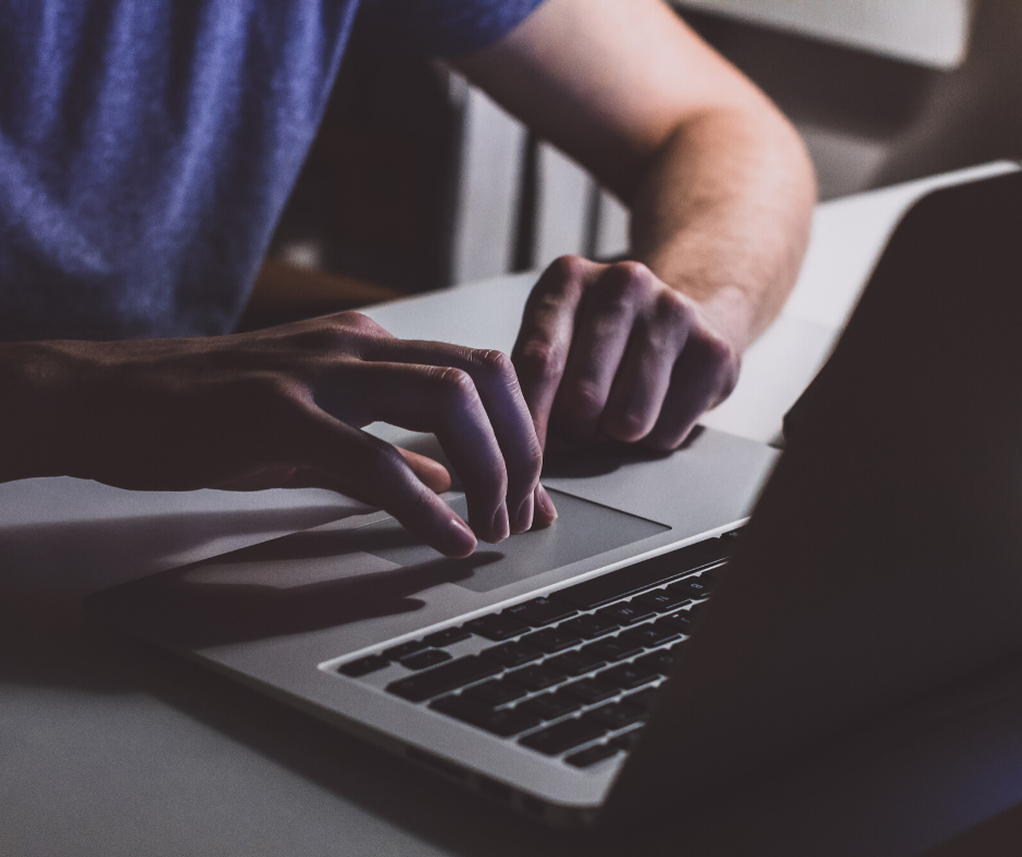 Two hands and a laptop keyboard