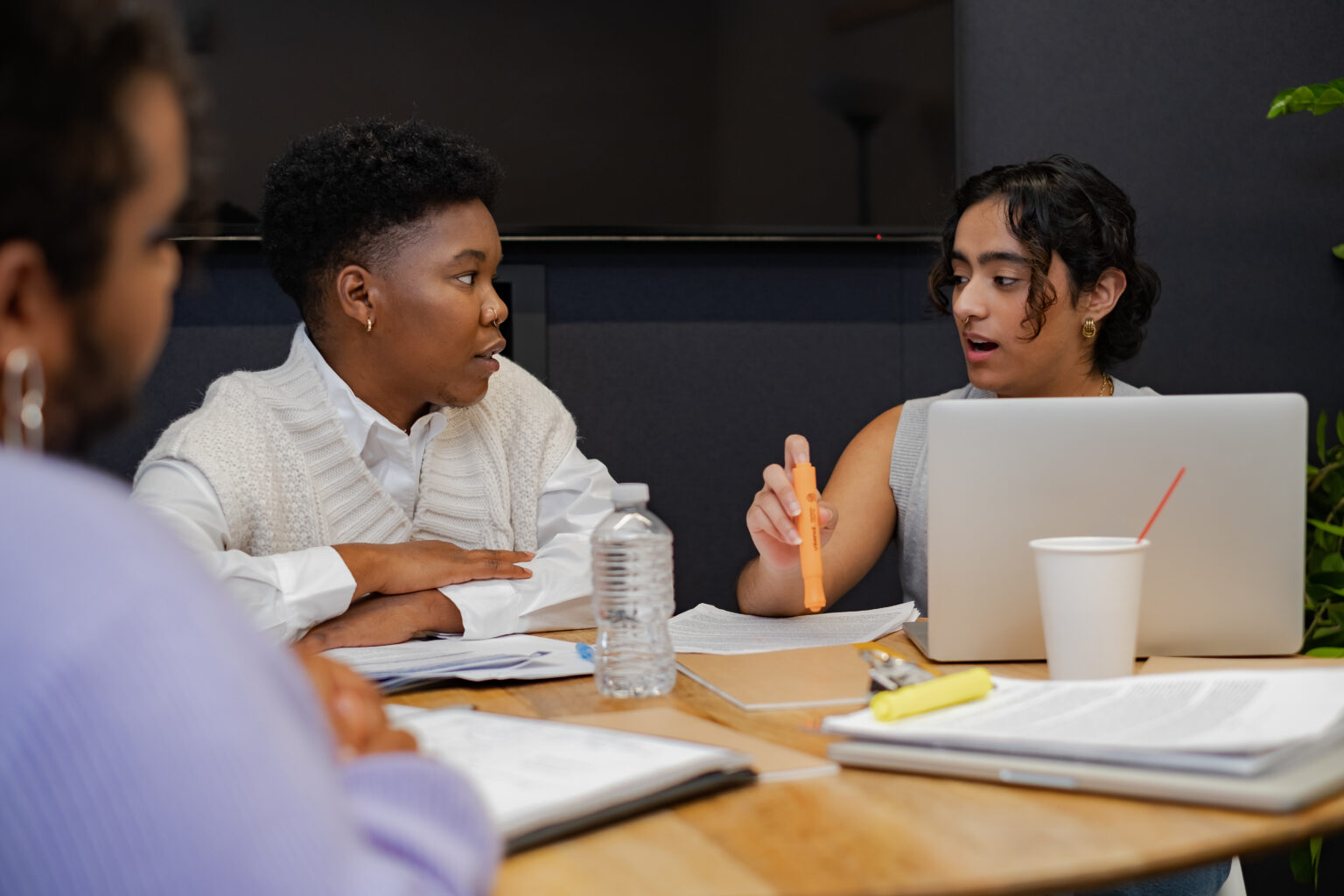 A-trans-person-and-a-trans-man-discussing-something-in-a-meeting