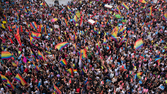 Istanbul, Turkey - June 2013: People in Taksim Square for LGBT pride parade in Istanbul, Turkey. Almost 100.000 people attracted to pride parade and the biggest pride ever held in Turkey