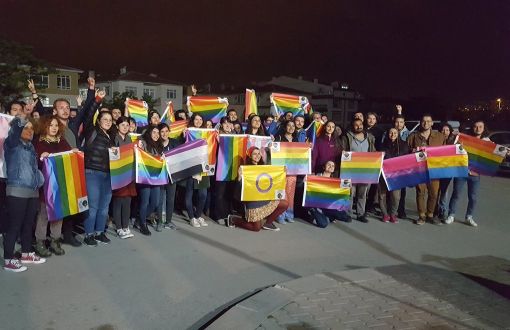 a group of LGBTI rights defenders in Turkey holding rainbow flags